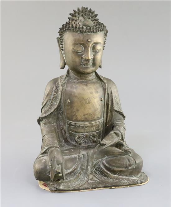 A Chinese bronze seated figure of Buddha Shakyamuni, 17th century, H. 25cm, small losses